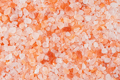 Himalayan pink salt texture. Natural minerals background. Directly above