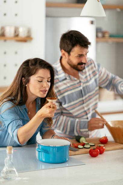 istock Young couple making breakfast at home. stock photo 1310322997