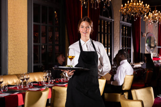 istock Portrait of cheerful young waitress 1310324319