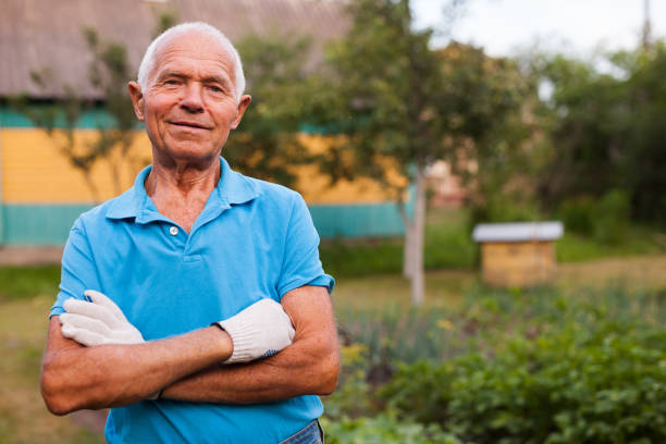 istock Elderly gardener posing in his garden 1310324490