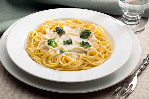 Broccoli spaguetti with cream sauce.