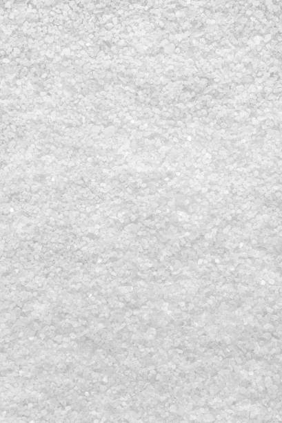 istock Background from white sea salt. Coarse rock salt texture. 1310324937