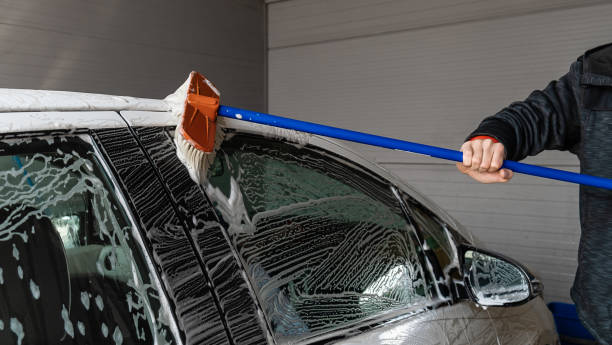 istock Man washing his car. 1310329474