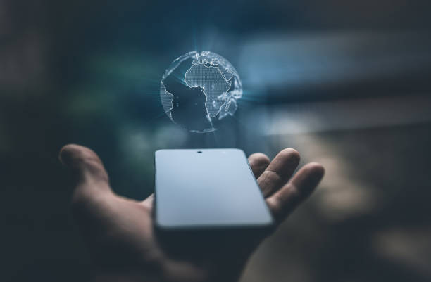 istock Earth hologram above smartphone screen 1310335471