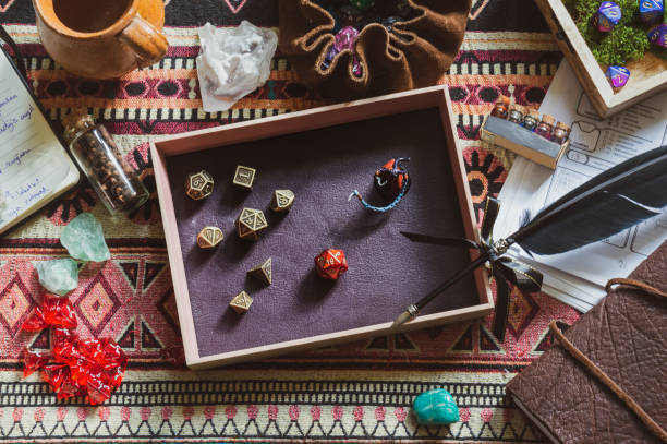 Image of a pink and purple dice tray with metallic dice stock photo