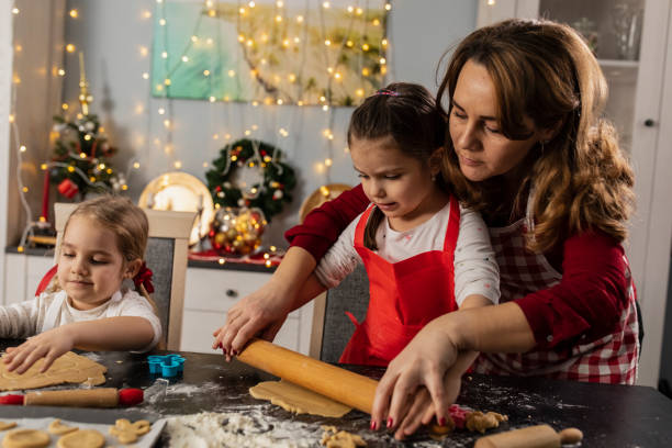 istock Working together on preparing gingerbread cookies 1310338632