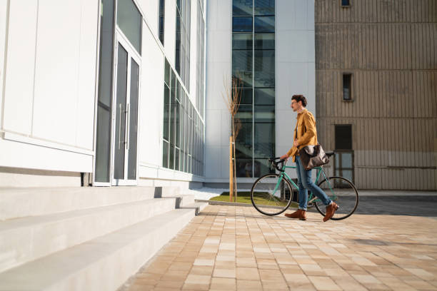 istock Side view of a man coming to work with his bicycle 1310341422