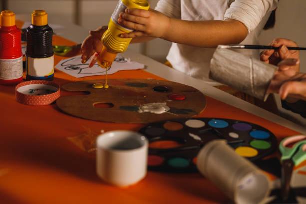 istock Preparing paint colors and painting 1310341618