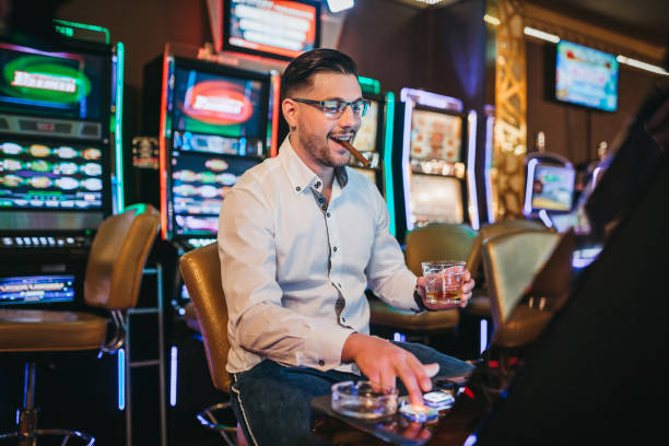 istock Casino player prepares a cigar 1310344441