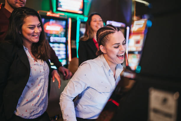 istock Friends gambling on slot machines 1310346991