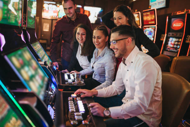 Excited friends winning in a casino Excited woman winning in a casino casino photos stock pictures, royalty-free photos & images