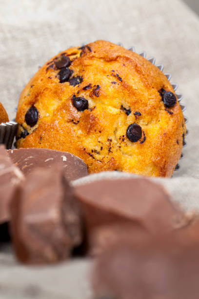 istock small chocolate cupcake on the table, delicious food 1310347803