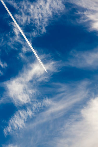 istock fast transport leaves behind a white contrail trail 1310347817