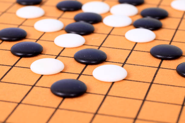 istock chinese game go,  Gobang and go game board 1310348716