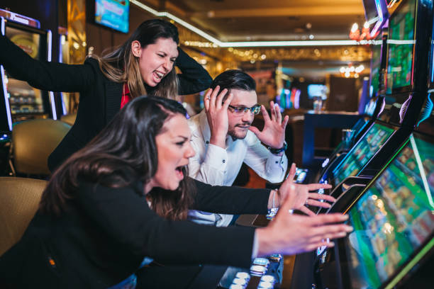 istock People gambling on slot machines 1310349608
