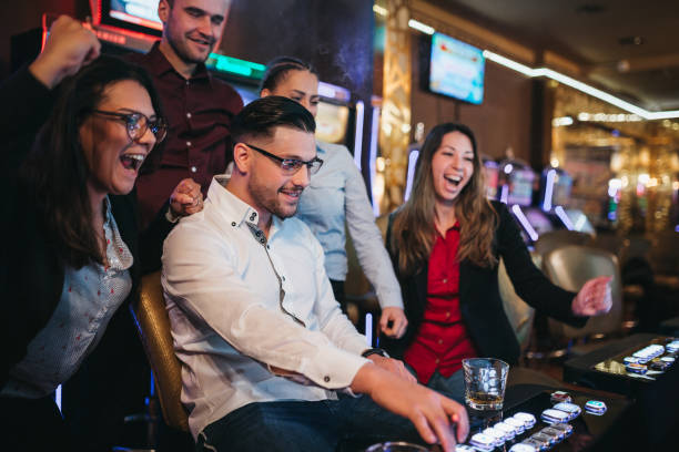 istock People gambling on slot machines 1310350384