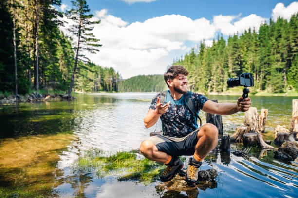 istock Young explorer photographing nature and vlogging. 1310352437