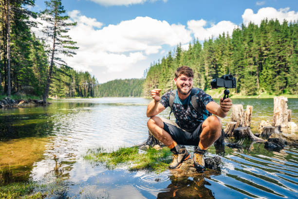 istock Young explorer photographing nature and vlogging. 1310352442