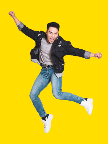 istock Excited handsome  young man in casual clothes jumping 1310355340