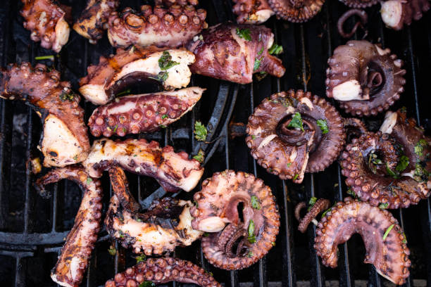 istock Cooking octopus on a barbeque grill 1310357825