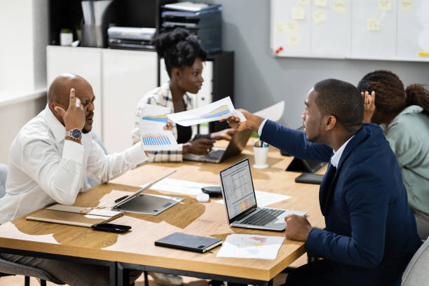 istock Angry Office Business Meeting Argument. African Group Arguing 1310357931