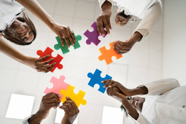 istock African Medical Doctors Holding Puzzle Together 1310357951