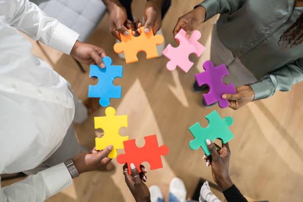 istock People Hand Holding Colorful Puzzle 1310358488