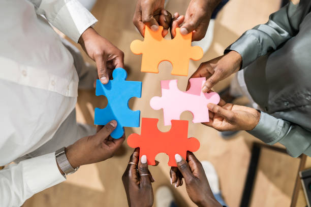 istock People Hand Holding Colorful Puzzle 1310358493