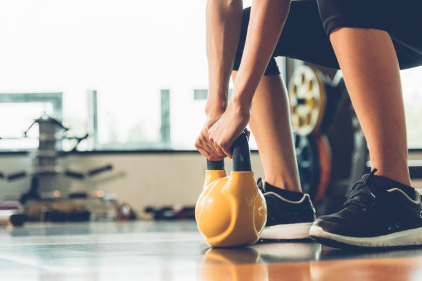 istock Beautiful woman using dumbbell weights workout 1310358622