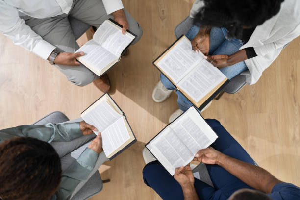 istock African Group Of People Reading Religious Book 1310358793