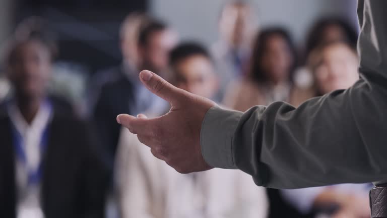 4k video footage of an unrecognizable businessman delivering a presentation at a conference