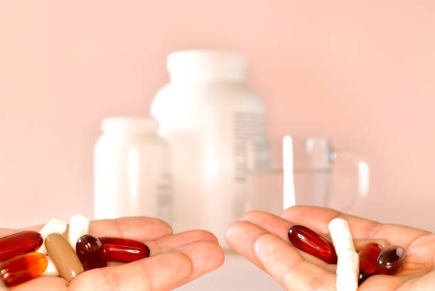 istock Hands full of various food supplements 1310366663