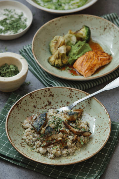 istock Grilled Mackerel with Pearl Barley. Grilled Salmon with Vegetables 1310371451