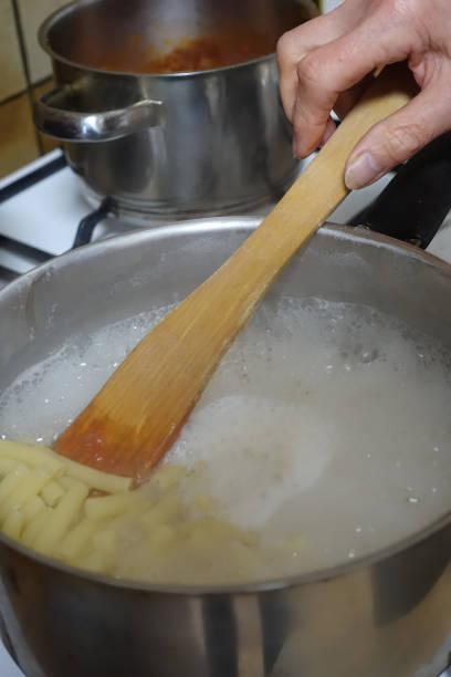 istock Cooking cannelloni pasta in boiling water 1310377505