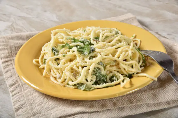 Homemade pasta salad with arugula and parmesan cheese