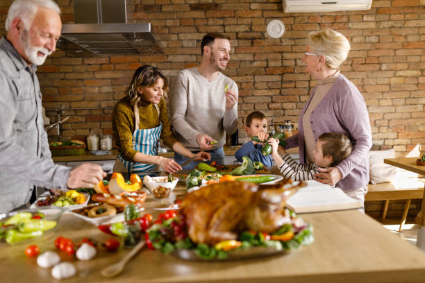 istock Happy multi-generation family making Thanksgiving lunch in the kitchen. 1310383368