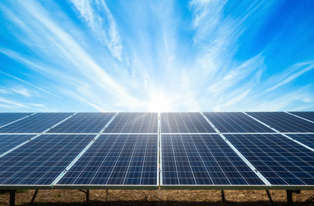istock power solar panel on blue sky background,alternative clean green energy concept 1310383416