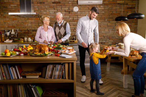 istock Happy multi-generation family enjoying in preparing Thanksgiving meal. 1310383464