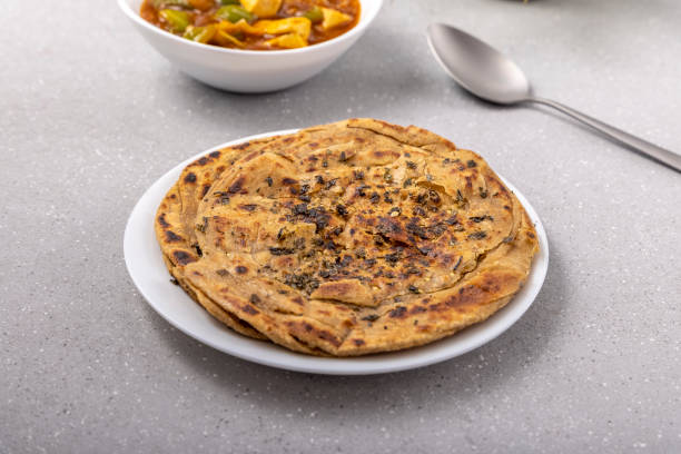 lachha paratha ou chur chur naan com paneer chilli - chur - fotografias e filmes do acervo