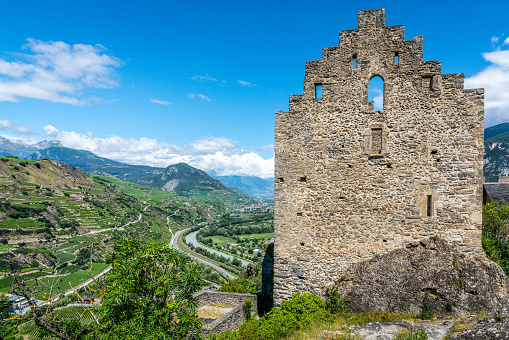 Sion Switzerland , 3 July 2020 : Panorama of the ruins of Tourbillon castle and aerial view of Valais canton with Rhone river and mountains in Sion Switzerland