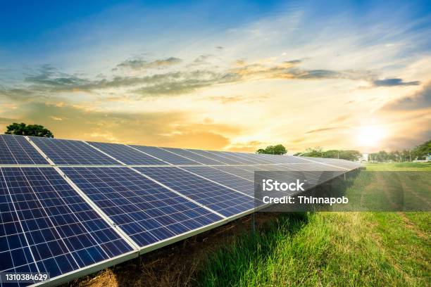 Solar Panel Cell On Dramatic Sunset Sky Backgroundclean Alternative Power Energy Concept Stock Photo - Download Image Now