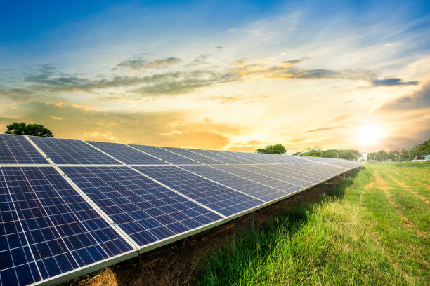 solar panel cell on dramatic sunset sky background,clean alternative power energy concept. - sun imagens e fotografias de stock