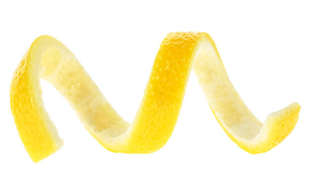 istock Ripe lemon twist isolated on a white background. Lemon peel curl. 1310385579