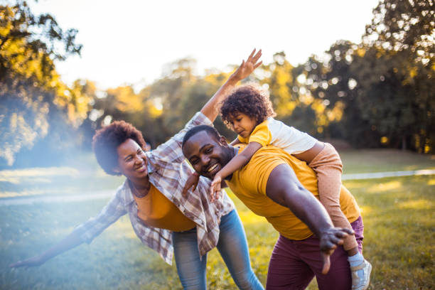 istock Happy child  having fun with her parents in nature. 1310385591