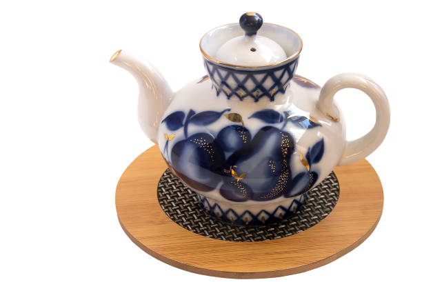 istock Stylish brewing little teapot on a white background. 1310386404