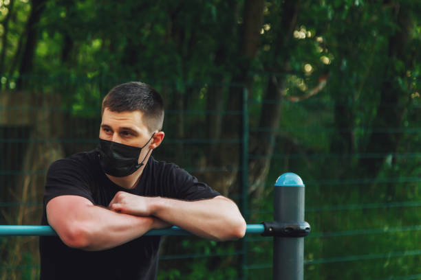 istock Young guy, an athlete stands at crossbar 1310389268