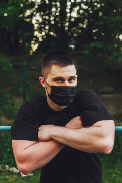 istock Young guy, an athlete stands at crossbar 1310389276