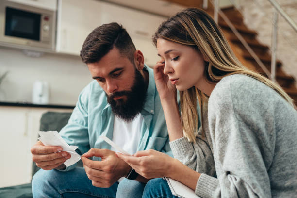 istock Couple shopping online with laptop 1310389459