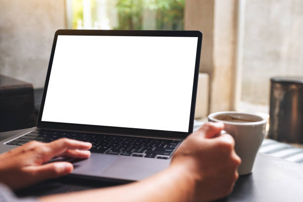 istock a woman using and touching on laptop touchpad with blank white desktop screen while drinking coffee 1310390435