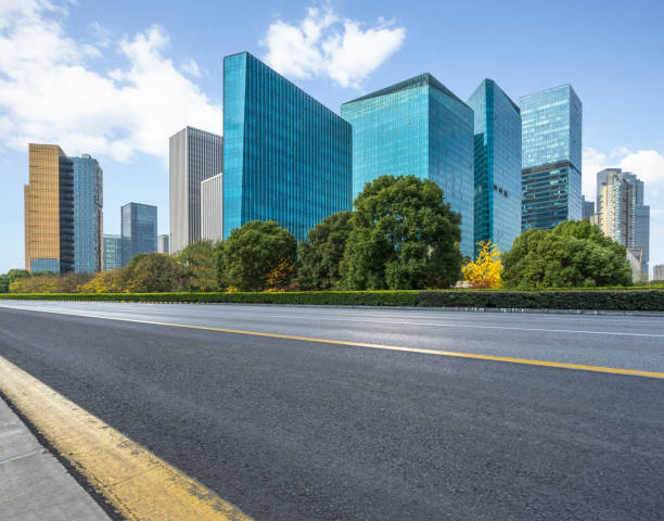 istock empty asphalt road with city skyline background in china 1310390785